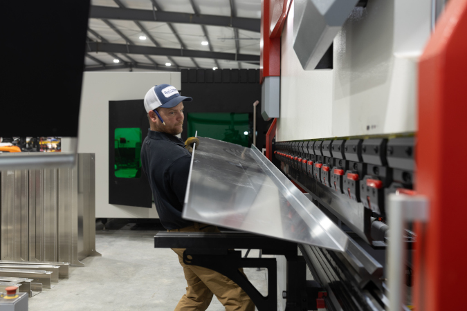 Joe Moore of JM Weldco, using laser cutter